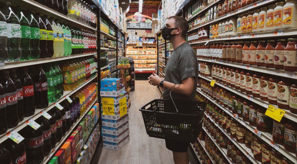 man in grocery store wearing mask